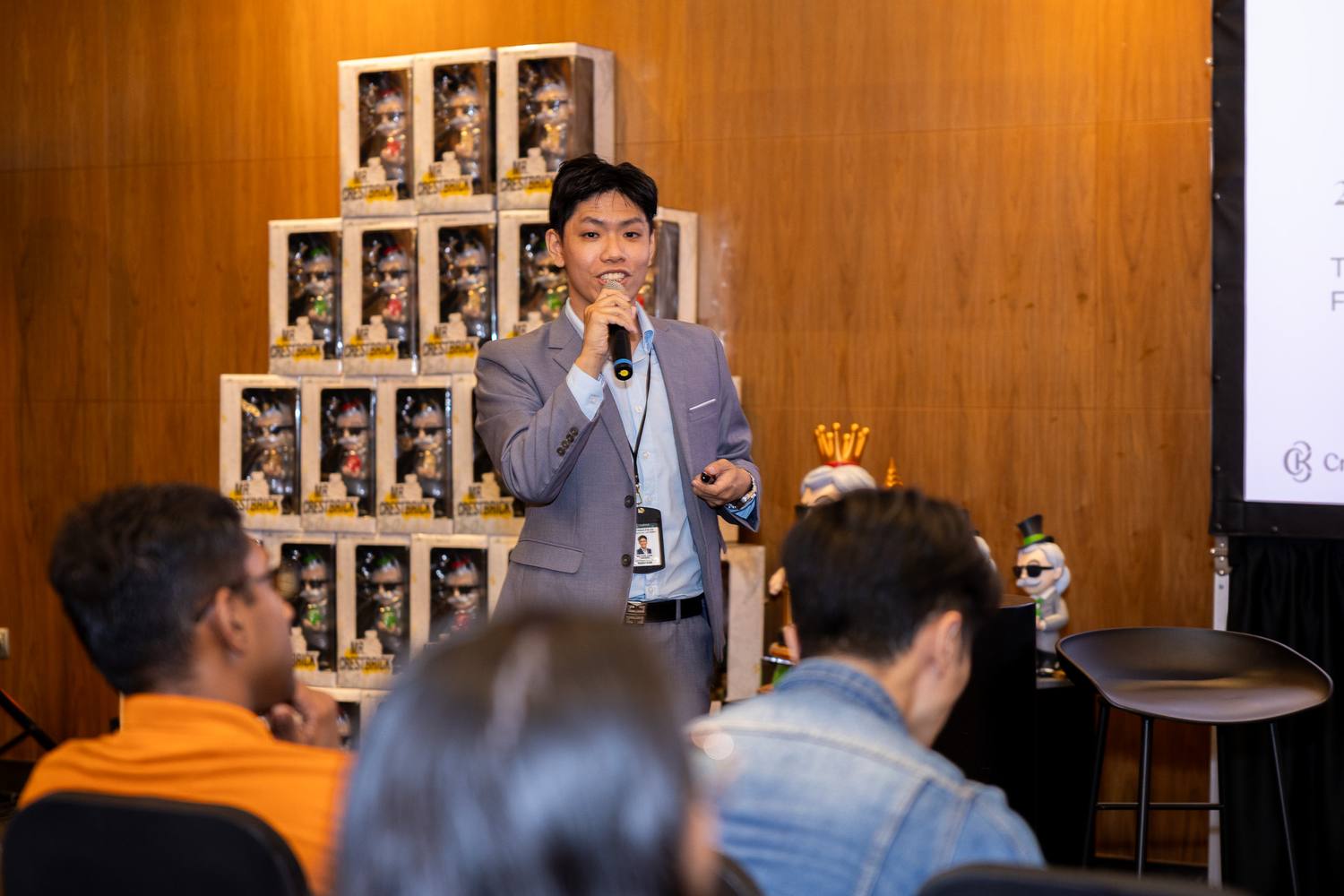 A Crestbrick associate presenting market research to clients at a Crestbrick event