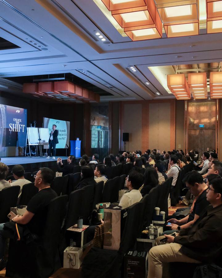 A full hall of attendees at a Crestbrick property masterclass