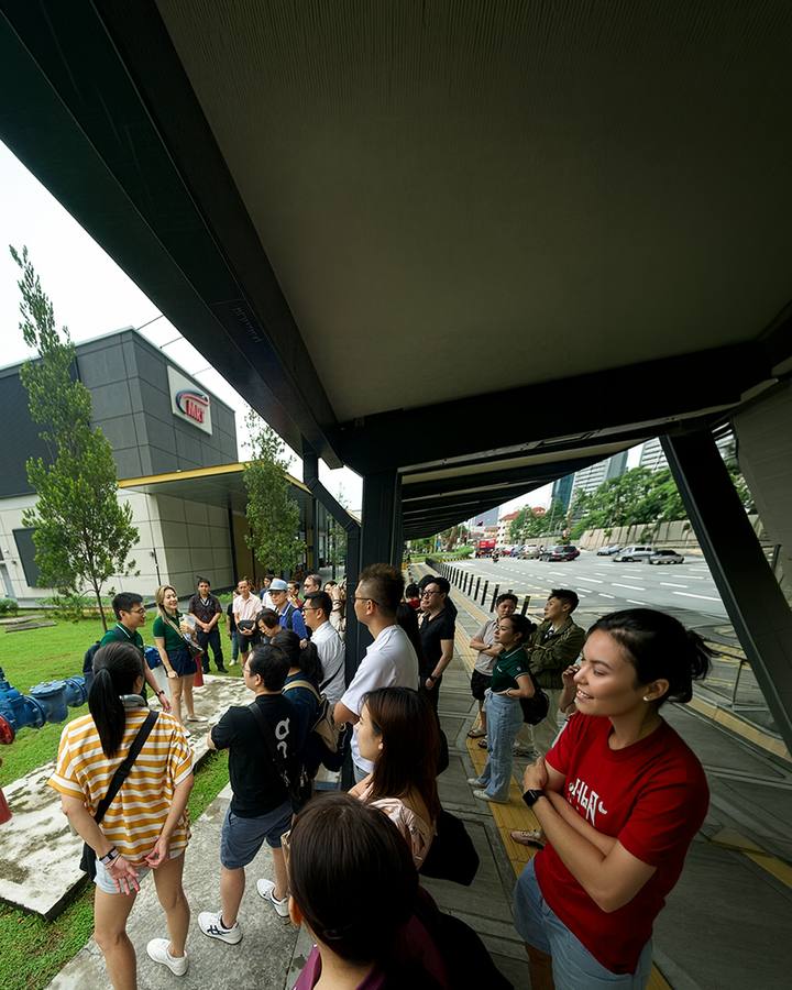 The Crestbrick client group gathered on the lawn outside a Kuala Lumpur development