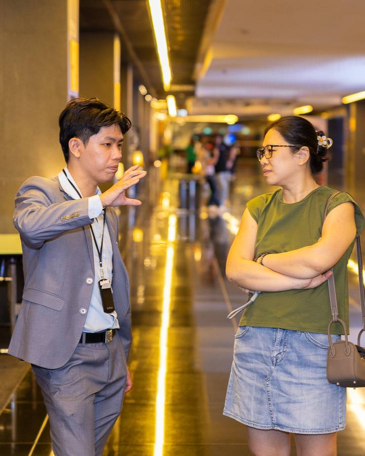 A Crestbrick associate walking a client through a Kuala Lumpur development