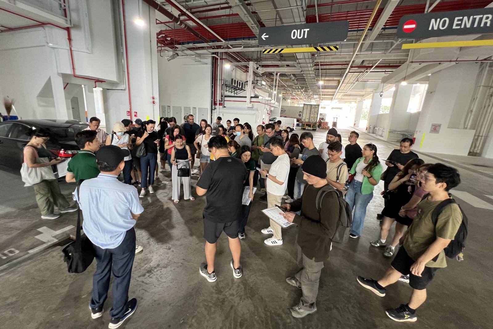Clients inside a high-ceiling vacant industrial unit on a Crestbrick site visit