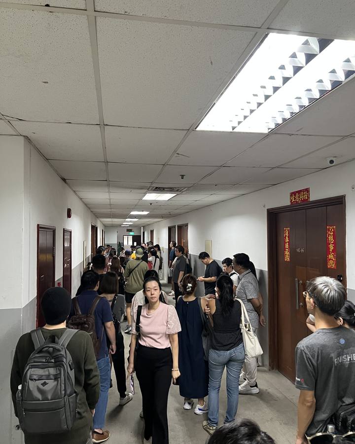 Clients touring the corridors of an older industrial building