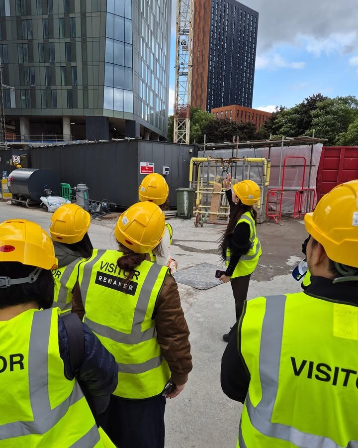 Crestbrick clients on a hard-hat construction site tour of a UK development